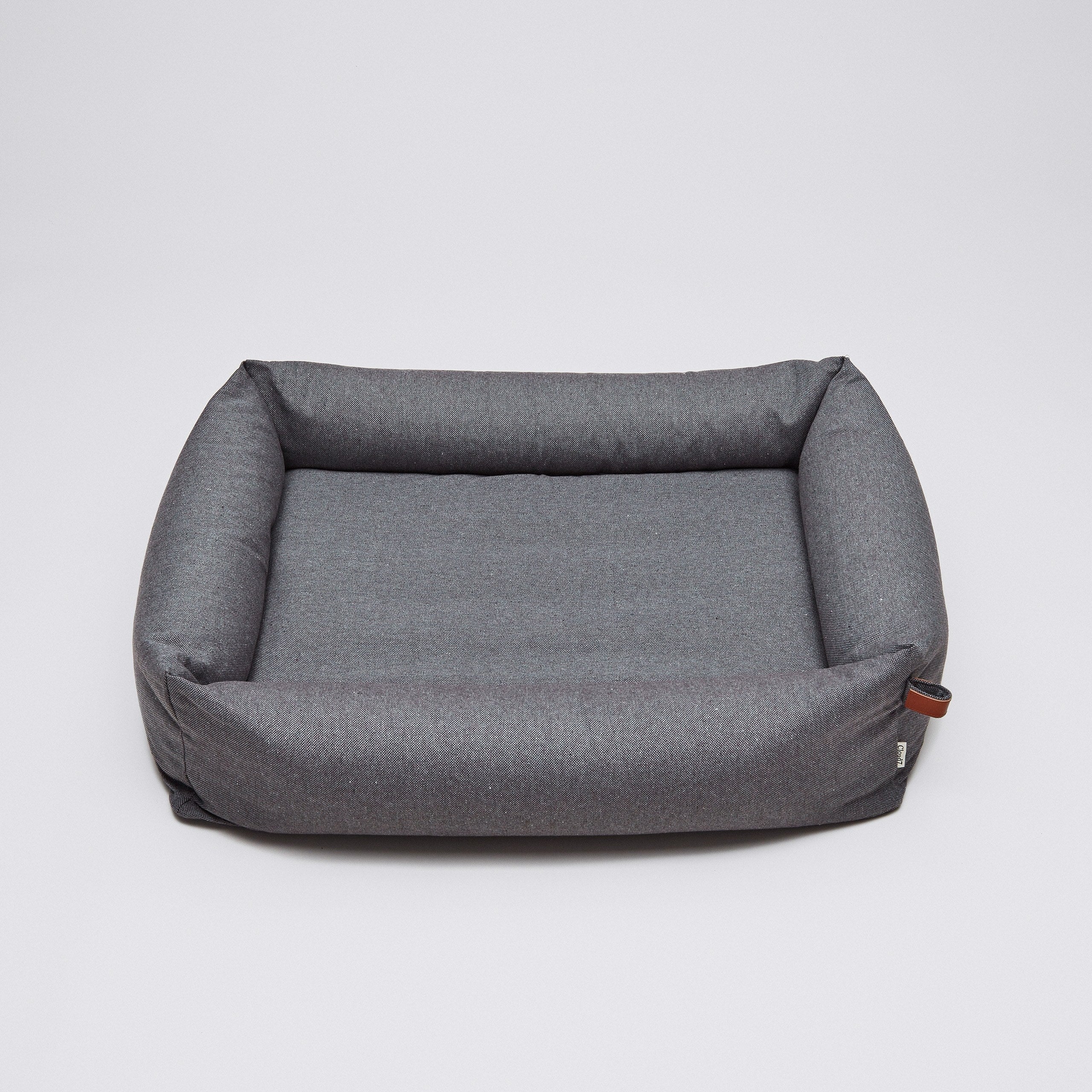 Dunkelgraues Hundebett mit Umrandung aus Tweed-Stoff mit Lederdetail