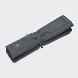 rolled up dark grey water repellent dog mat