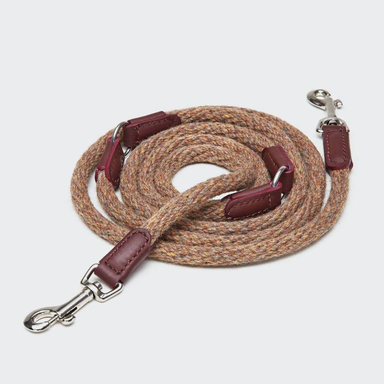 Rolled up light fabric leash with wine-red leather elements