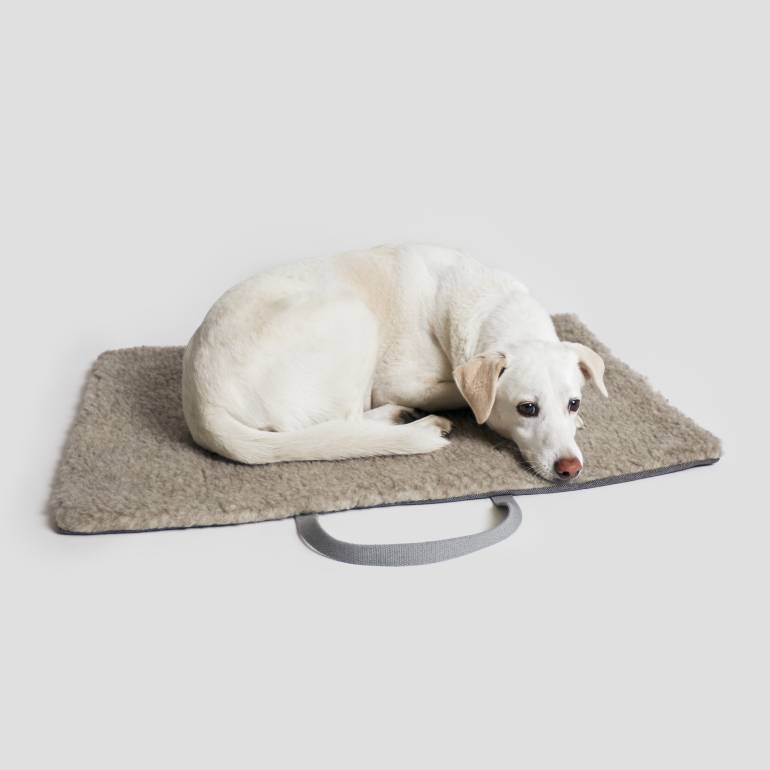 foldable grey travel bed with wool inside