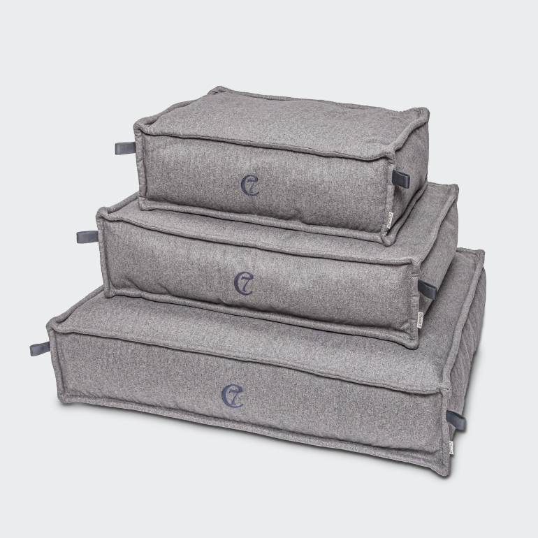 3 light grey dog beds